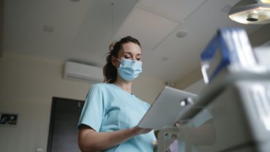 photo of woman wearing a surgical mask