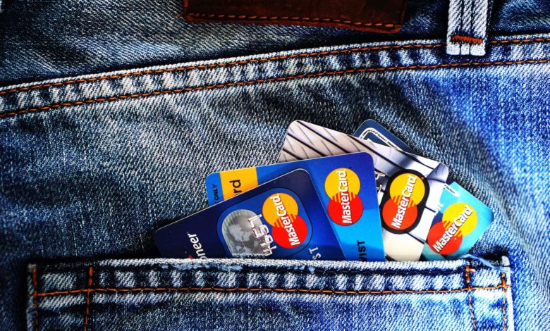 blue master card on denim pocket