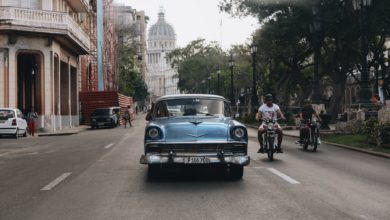 blue vintage car on the road