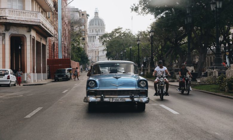 blue vintage car on the road