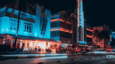 vehicle light trails in front of the breakwater hotel at night