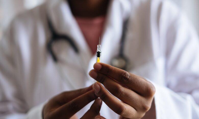 person holding injection