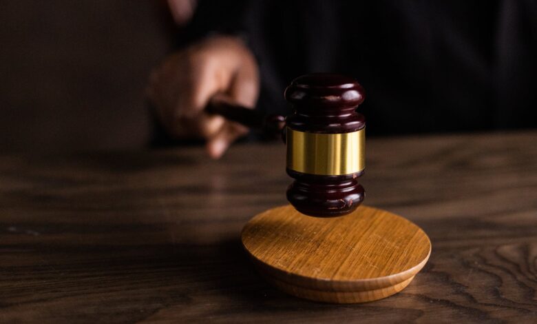brown wooden gavel on brown wooden table